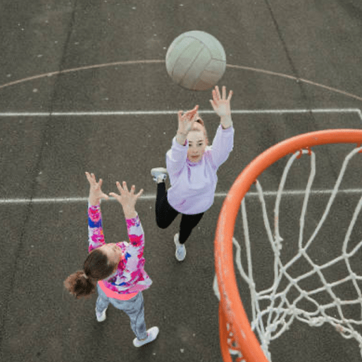 Girl shooting at netball camp