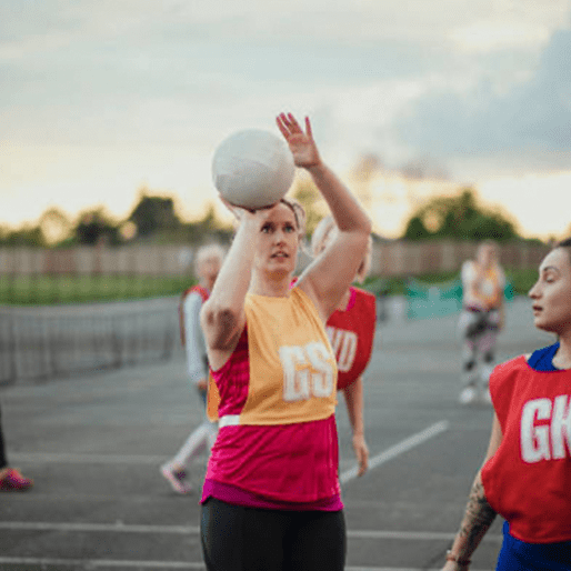 Woman looking to shoot at a netball tournament